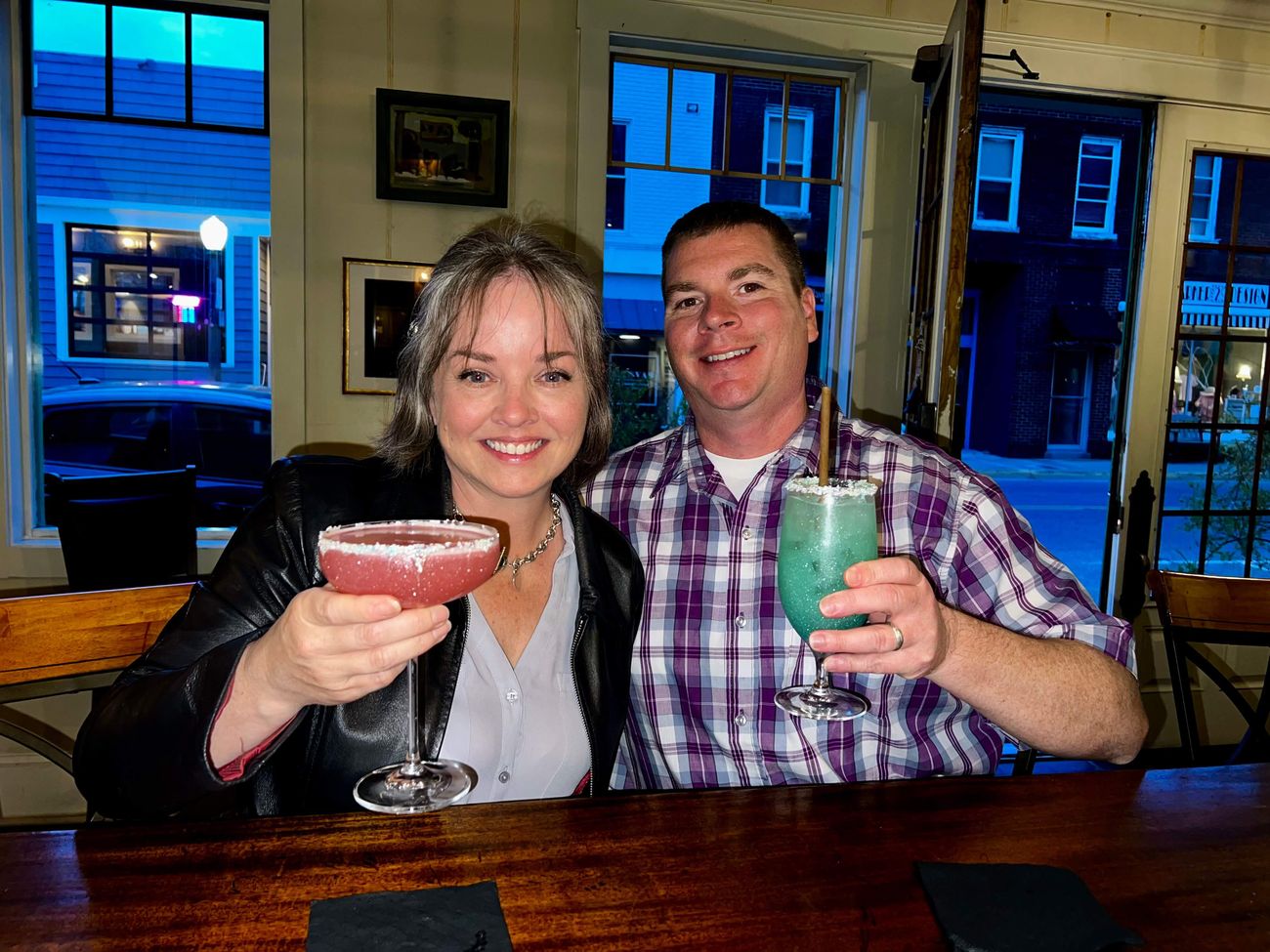 Guests raising cocktails at The Charlotte